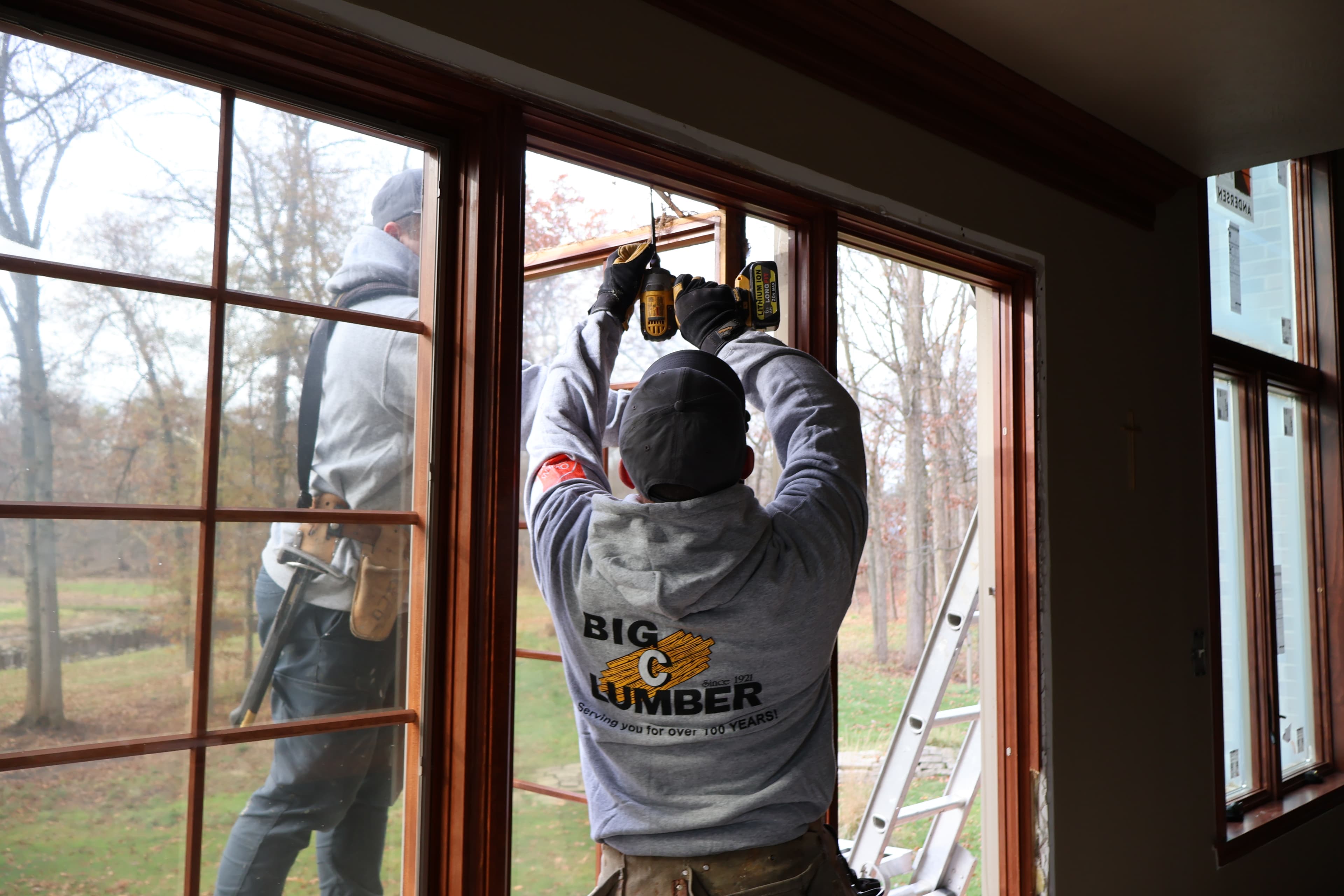 Installation crew installing a window